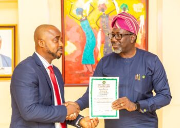 Omosehin Presents license to NPF Insurance Co